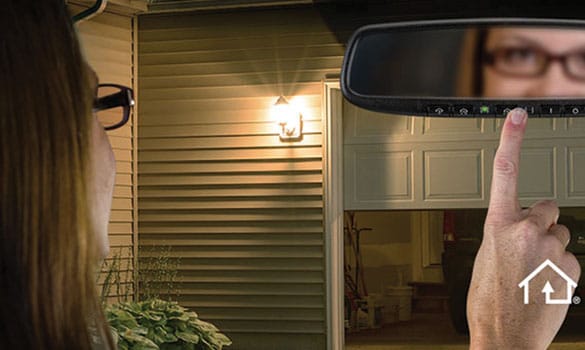 Woman using garage door opener