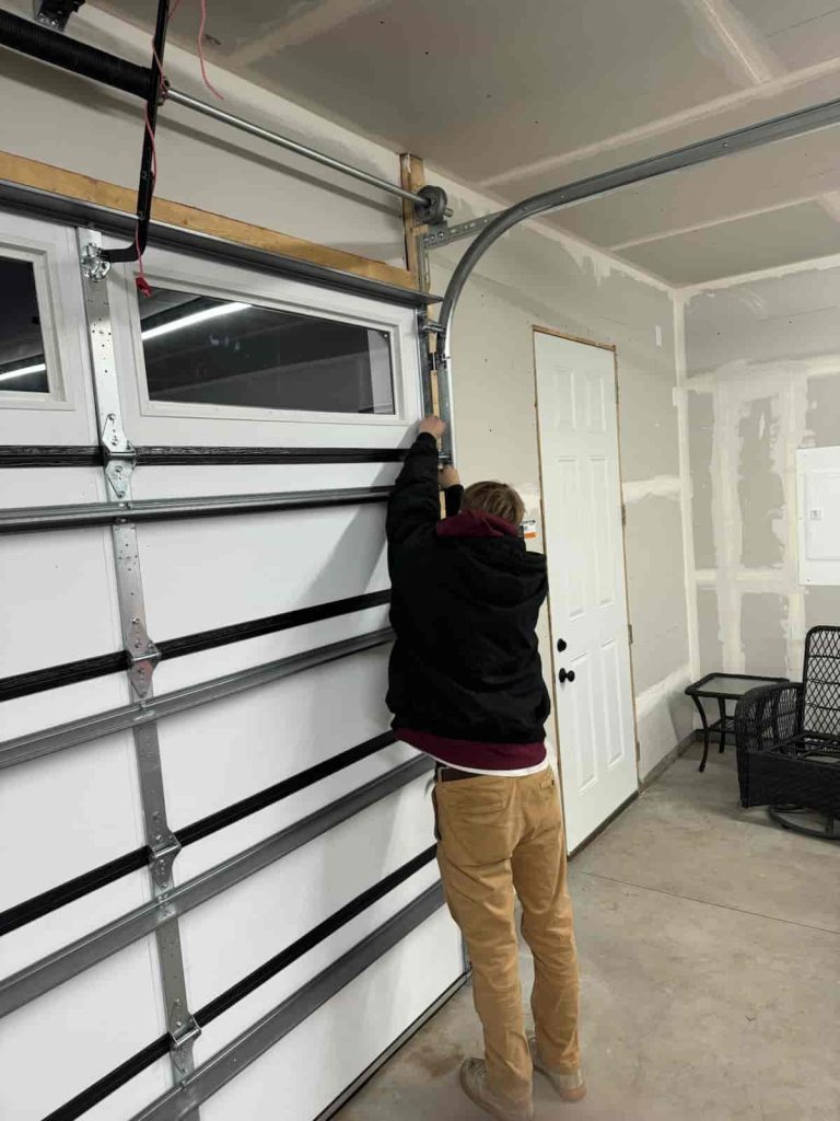 Man repairing a garage door