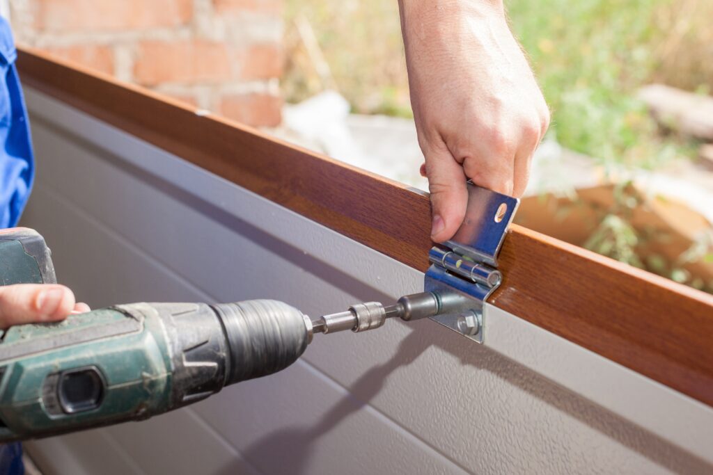 Drilling into garage door hinge